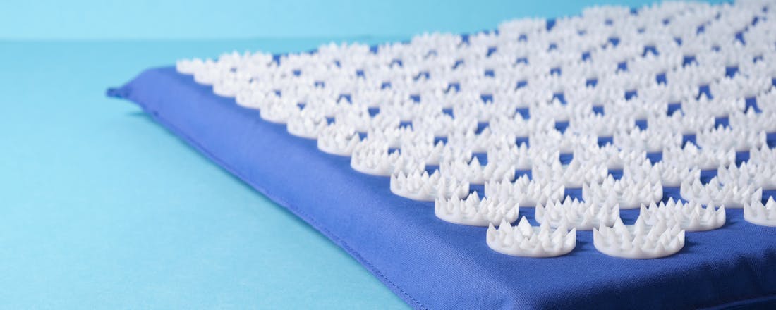 Massagemat druk punten blauw Wat een massagemat doet voor je gezondheid