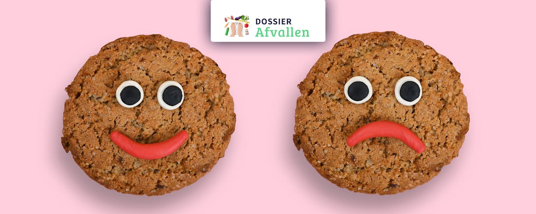 Lachend en sip kijkend koekje Wat is emotie-eten (en vooral: wat kun je ertegen doen?)