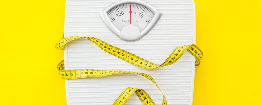 Weegschaal met meetlint De 25 beste tips om af te vallen
