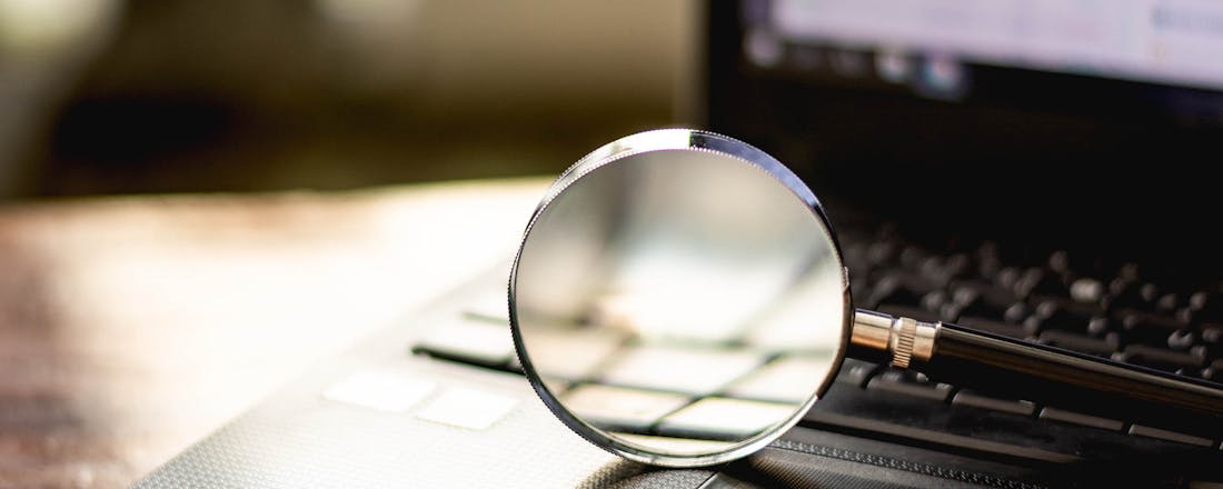 Vergrootglas op laptop Nooit meer je spullen kwijt dankzij slimme gadgets en tools