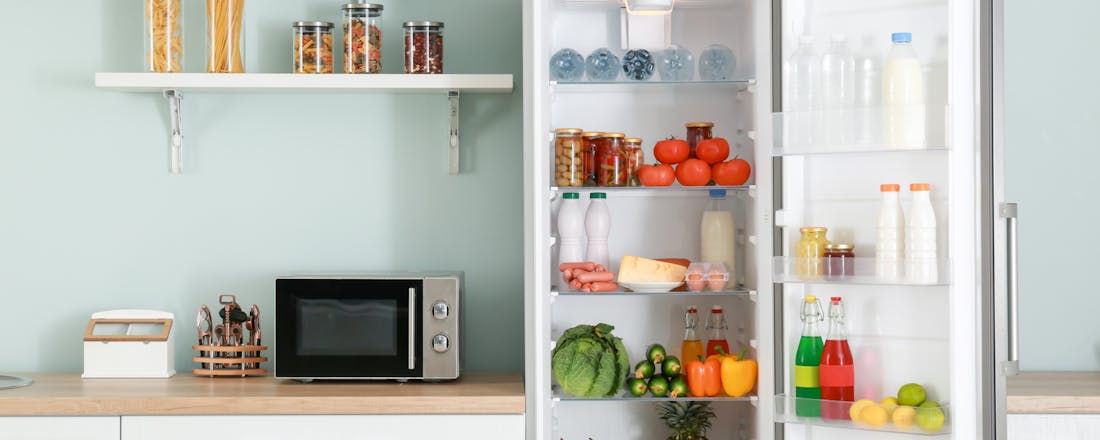 Open koelkast in keuken Waar voor je geld: 5 goedkope koelkasten van max 500 euro